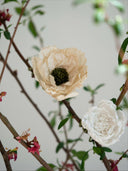 Dual-colored vintage-inspired crepe paper flowers. Handmade Christmas and seasonal ornaments in beige, black, brown, and white