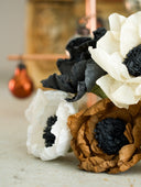 Dual-colored vintage-inspired crepe paper flowers. Handmade Christmas and seasonal ornaments in beige, black, brown, and white