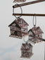 Metal birdcage ornament with painted metal and metal bird inside